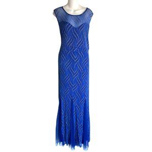 Elegant Blue Sleeveless Evening Gown With Shimmering Detail & Sheer Neckline